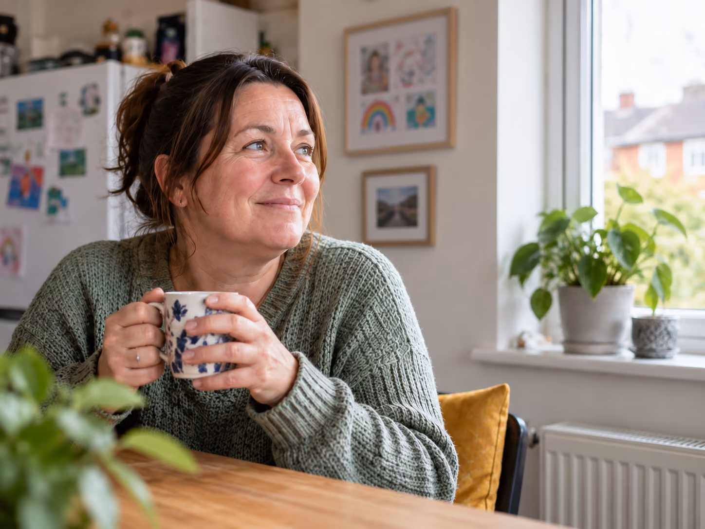 Tenant sitting at home with a cup of tea